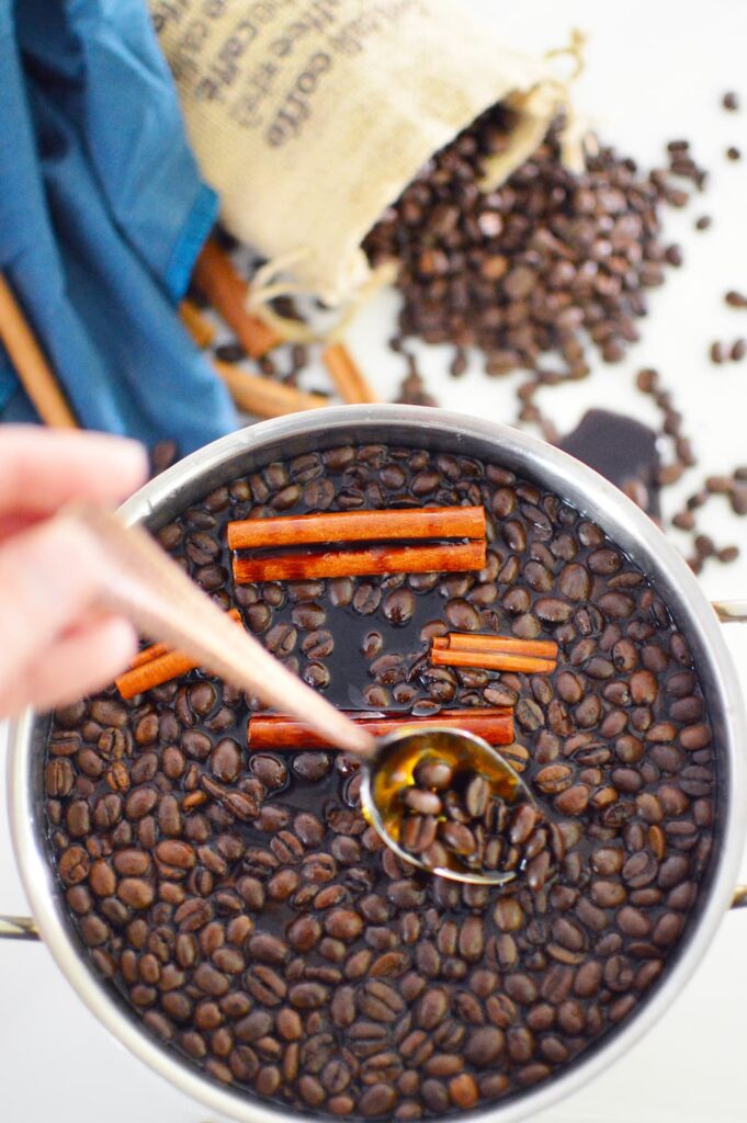 coffee smell air freshener in pot with coffee beans and cinnamon sticks