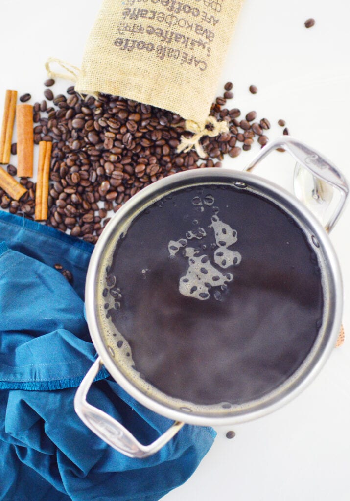 coffee smell air freshener simmering in pot with whole coffee beans 