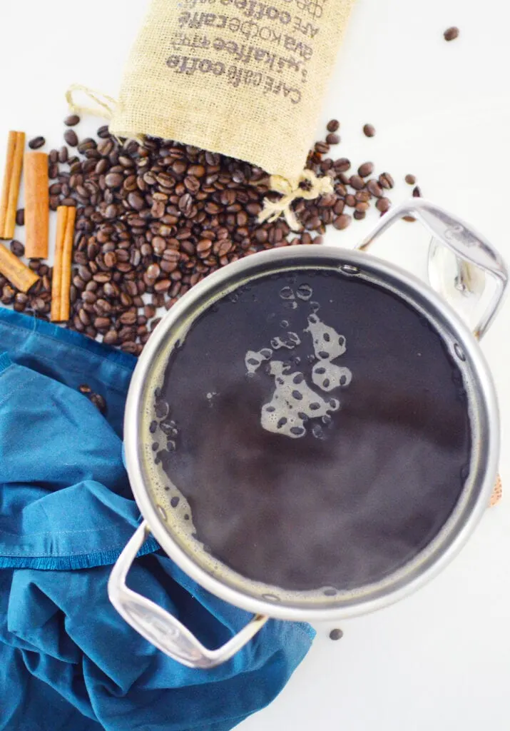 coffee smell air freshener simmering in pot with whole coffee beans 