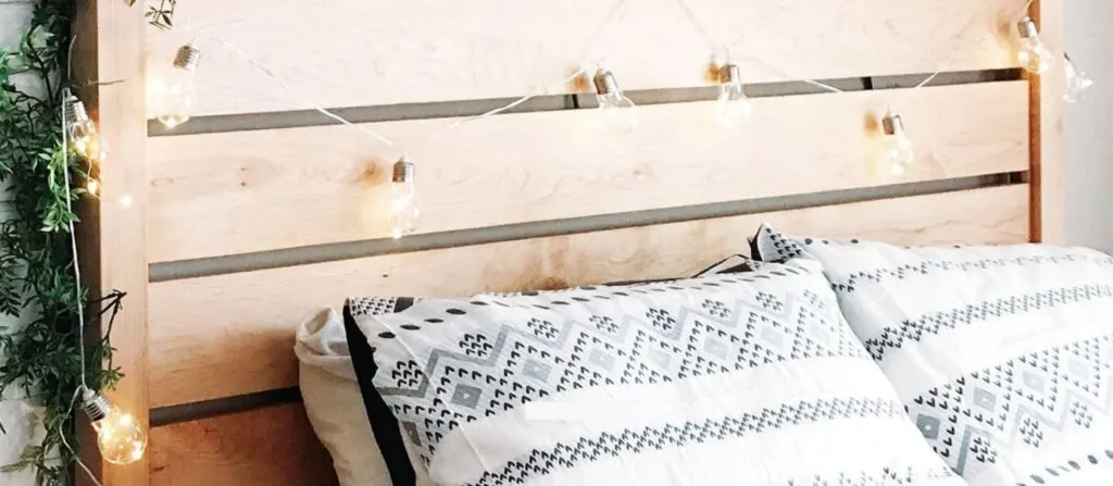 wooden slat headboard on hardwood bed frame