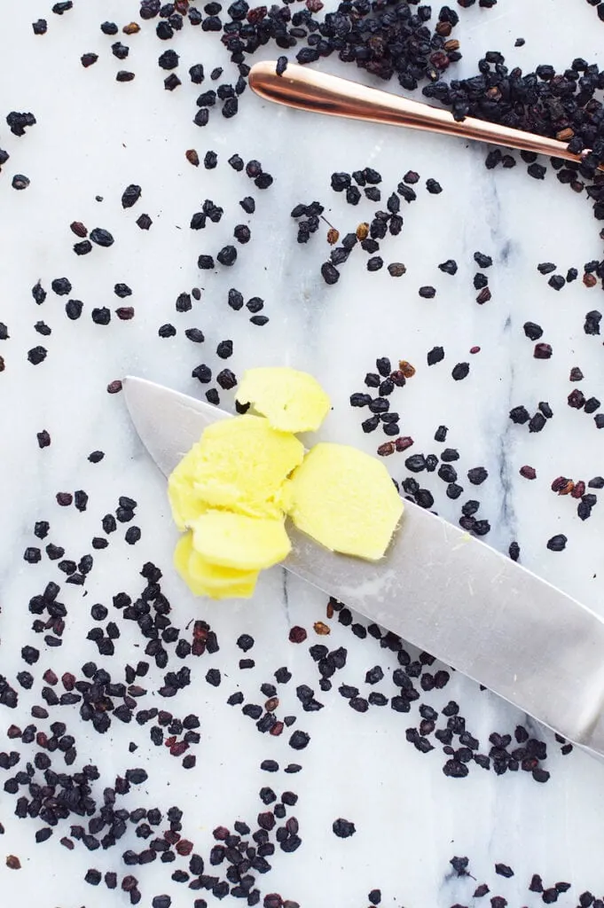 Cut Up Ginger Slices surrounded by Elderberries