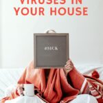 woman holding up a sign saying she is sick