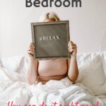 woman holding a board with word relax while sitting in bed
