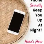 An iPhone rests on a round wicker tray. The text reads: "Does Your Phone Secretly Keep You Up at Night? Here's How To Tell!" The website "GetGreenBeWell.com" is noted at the bottom.