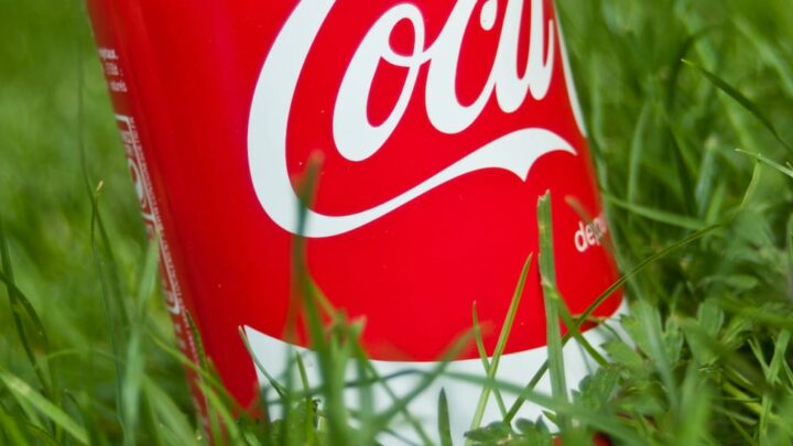 red Coke can in green grass