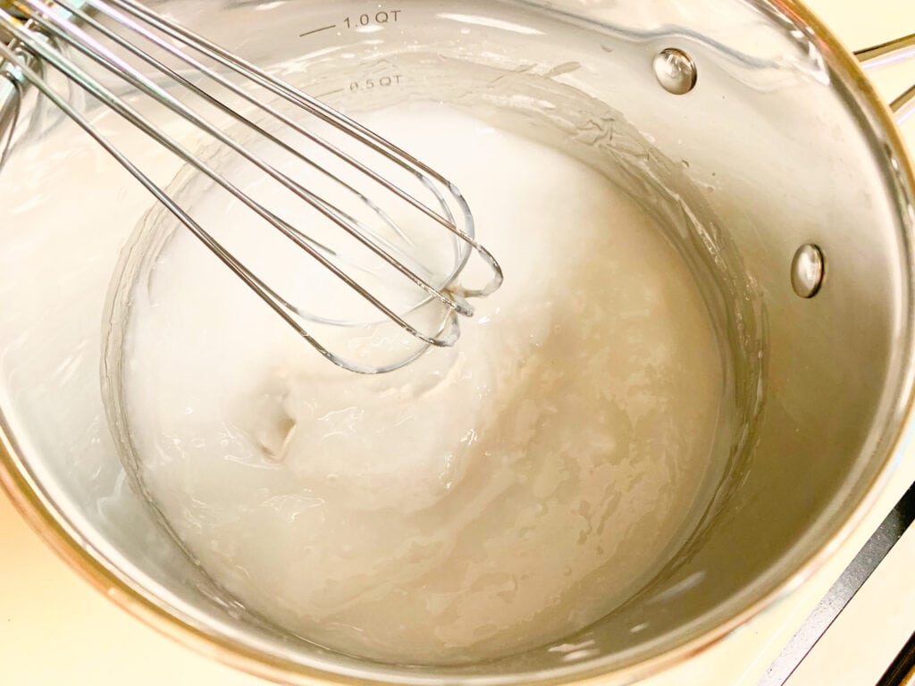 whisk in stainless steel pan with thick white gel