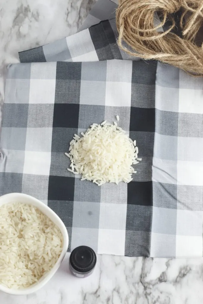 white rice on black plaid fabric with twine in a pile nearby