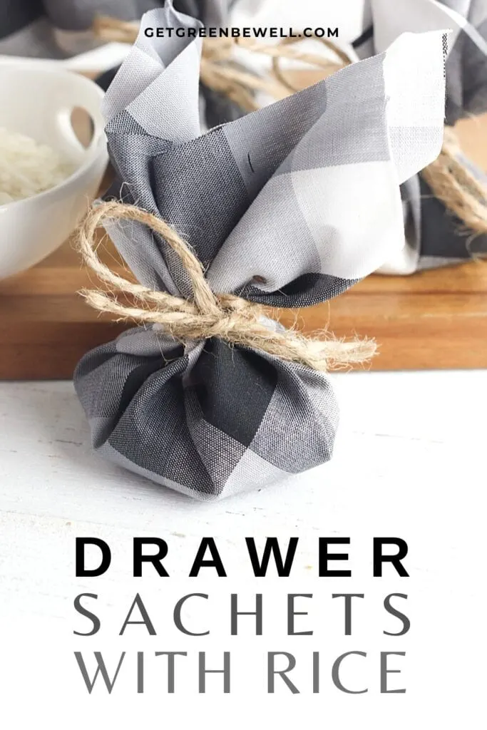 drawer sachet tied with twine on white surface with wooden cutting board behind