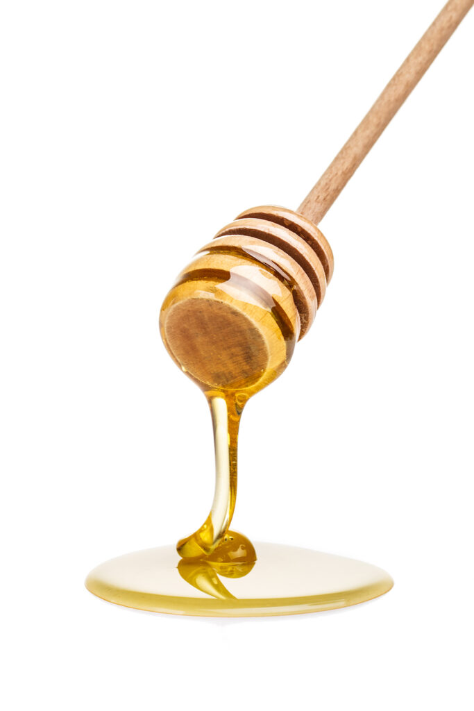 Honey drip isolated on white background