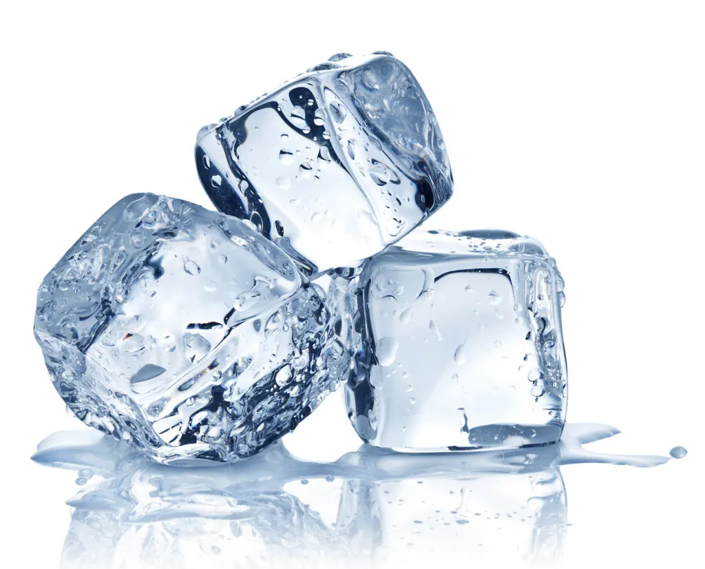 three ice cubes stacked against white background