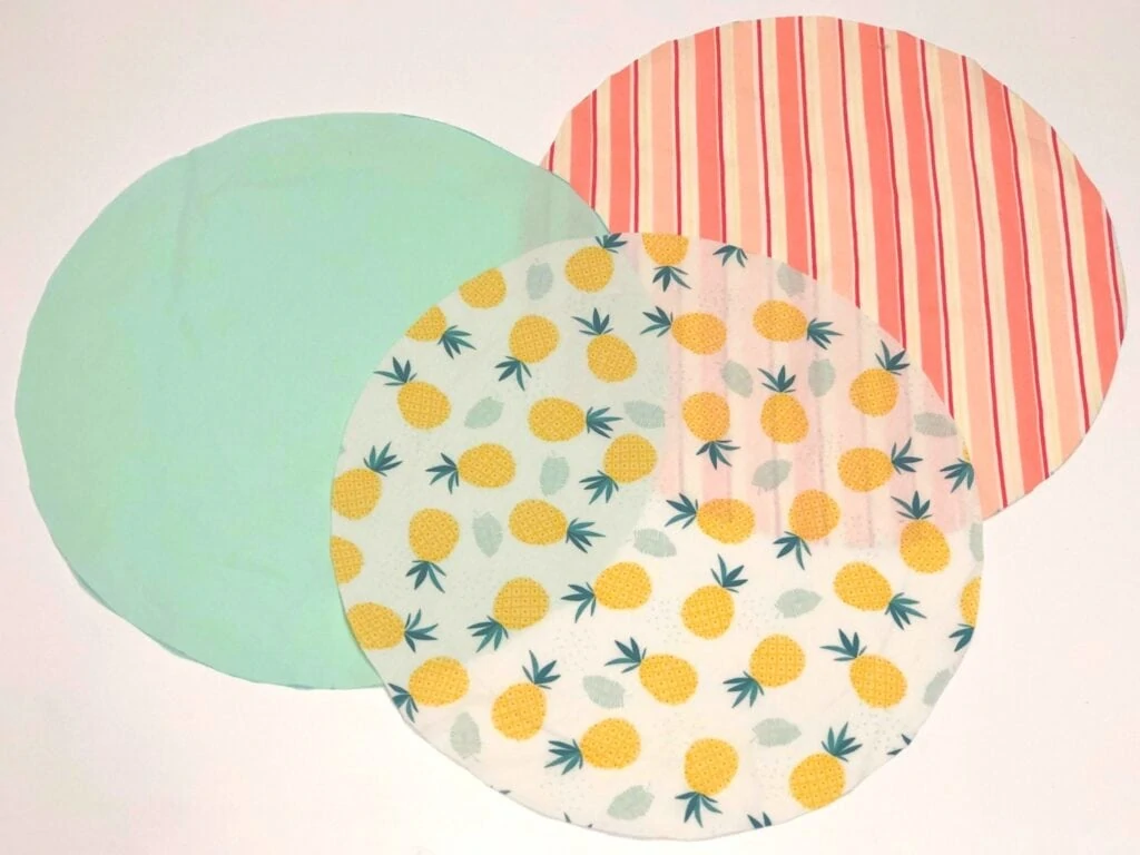 three fabric circles laying on white background
