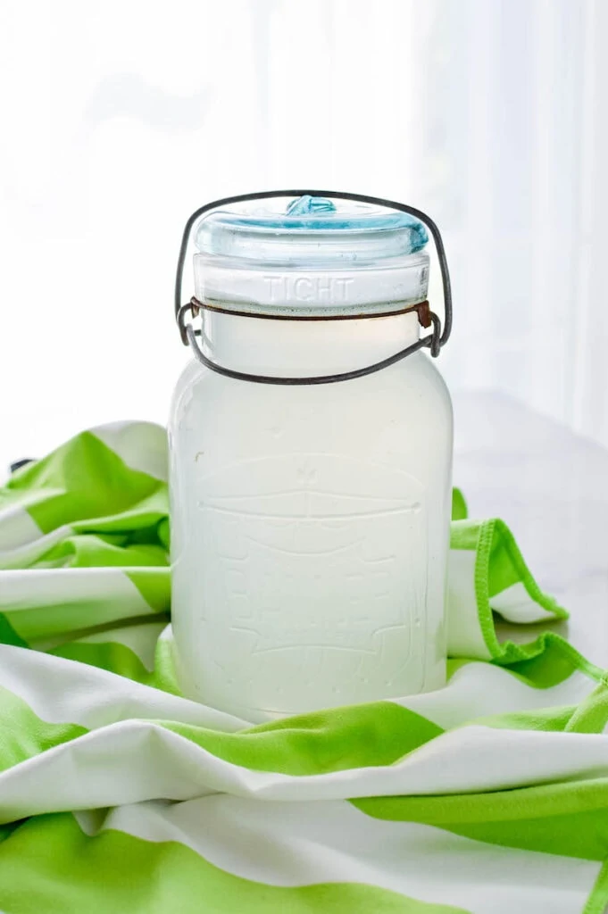 glass mason jar filled with liquid laundry detergent