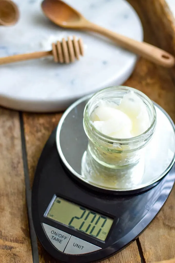 jar of beeswax on kitchen scale