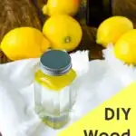 wood cleaner in glass jar surrounded by lemons