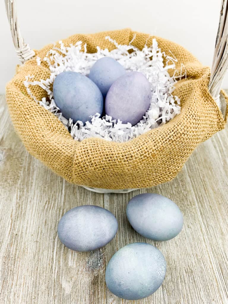 Blueberry Dyed Egg in basket and on wood table