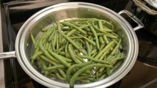 green beans in a stainless steel pan