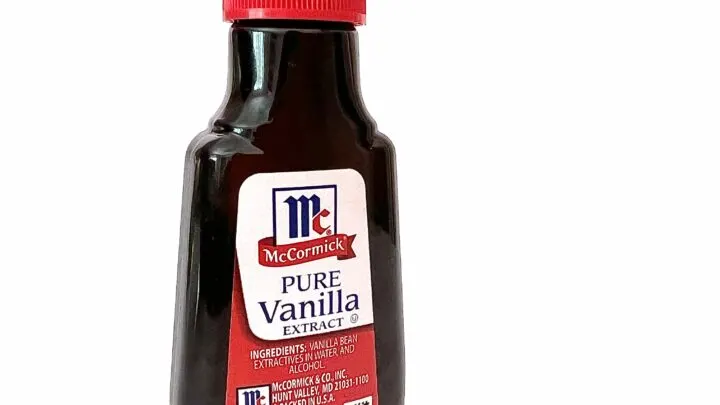 bottle of vanilla extract on white background