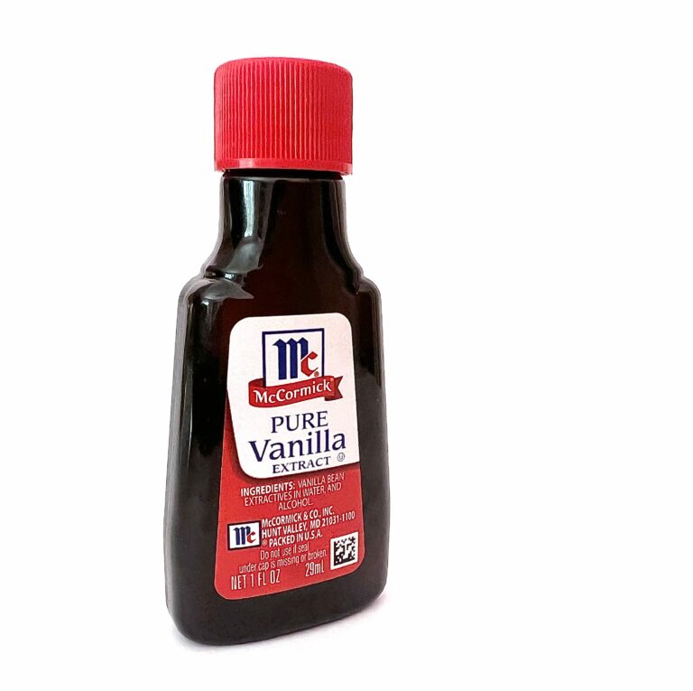 bottle of vanilla extract on white background