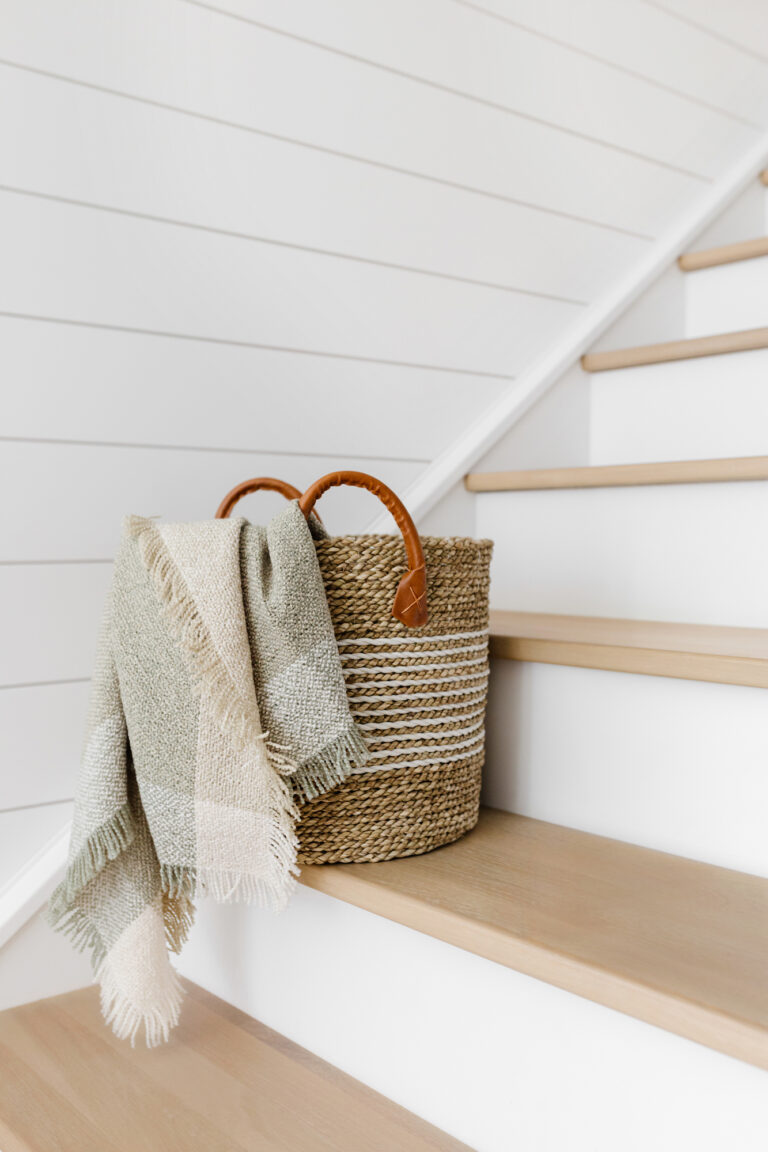 wool blanket in a basket on the stairs