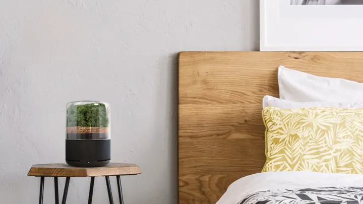 modern bedroom with pretty air filter on bedside table