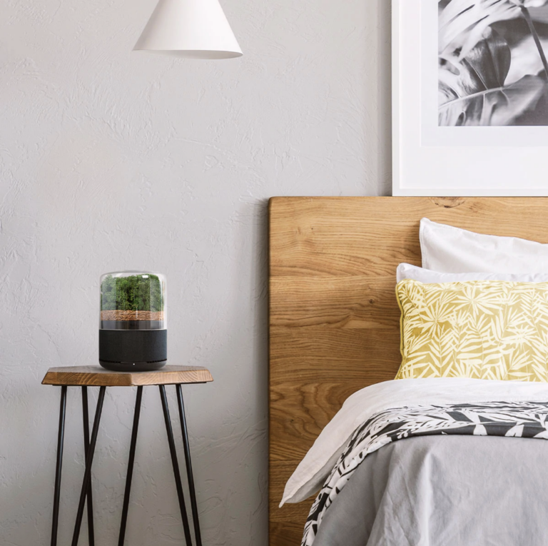 modern bedroom with pretty air filter on bedside table