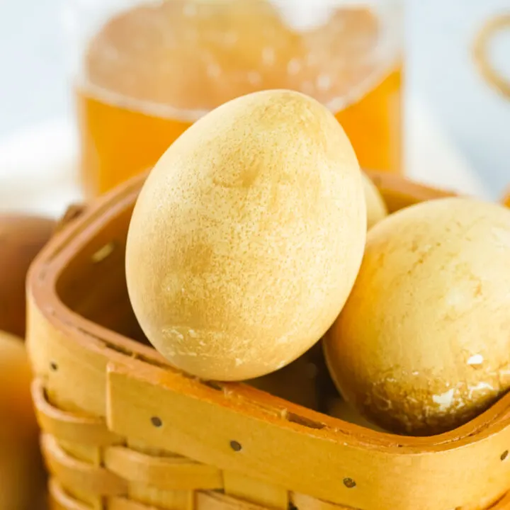 tea-dyed eggs in basket with jar of black tea in background