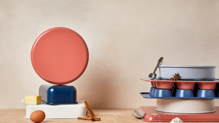 variety of pots and pans in different colors on kitchen countertop