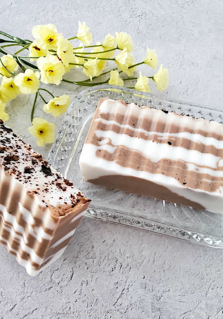 Chocolate Vanilla Soap in a clear crystal dish with flowers