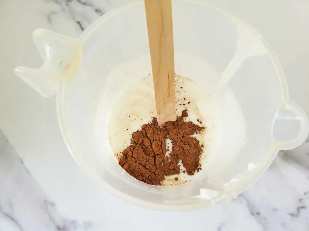 Chocolate Vanilla Soap Step 4 ingredients in a bowl against a white background