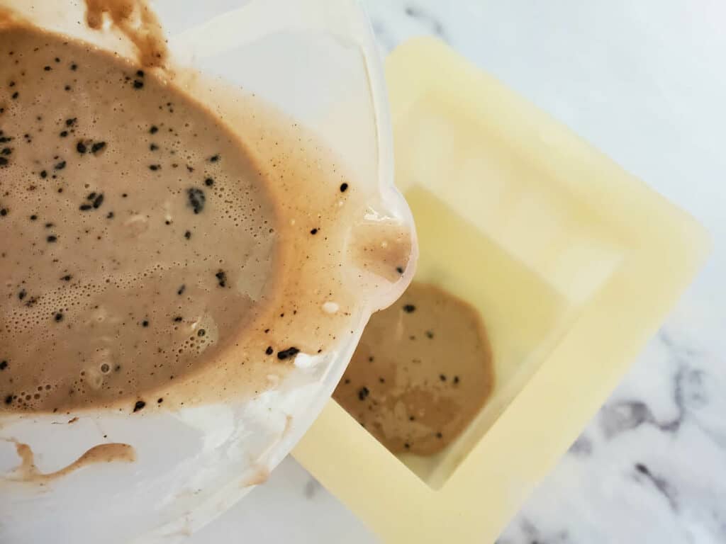 Chocolate Vanilla Soap Step 6 with bowl over a white background