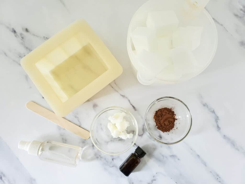 Chocolate Vanilla Soap Supplies on a white marble background