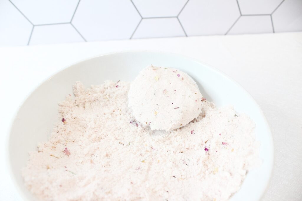 Rose Petal Bath Bomb Step 6 white bowl on white tile background