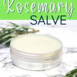 Homemade rosemary salve infused with fresh sprigs of rosemary.