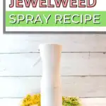 A spray bottle on a cutting board.