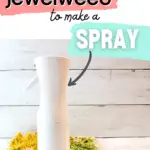 A white spray bottle on a cutting board.