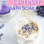 A cloth bag containing an oat bath soak with oatmeal and lavender rests on a white surface. Nearby, dried lavender sprigs accompany a small bowl holding a purple item. Text reads, "Oatmeal and Lavender Bath Soak.